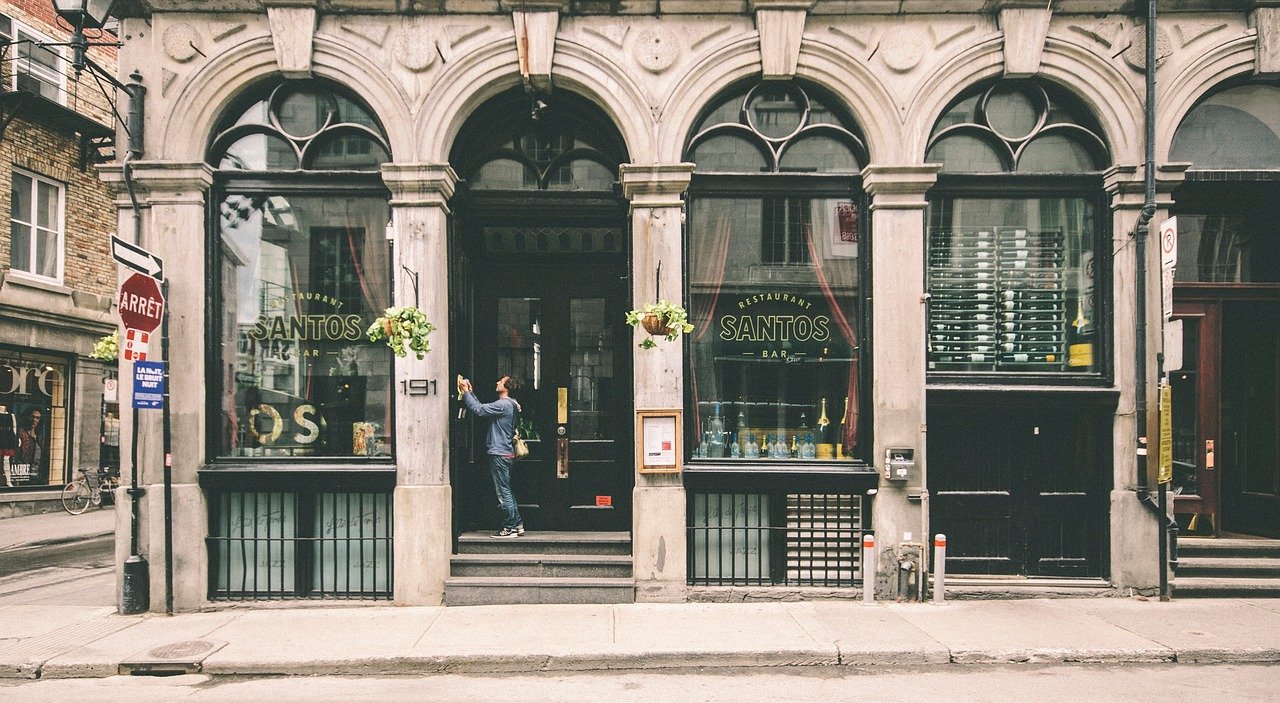 Local business storefront connected to AI assistant recommendation signals such as hours, location, reviews, and booking.